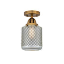 Stanton Semi-Flush Mount shown in the Brushed Brass finish with a Clear Wire Mesh shade