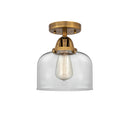 Bell Semi-Flush Mount shown in the Brushed Brass finish with a Clear shade