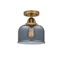 Bell Semi-Flush Mount shown in the Brushed Brass finish with a Plated Smoke shade