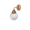 Beacon Sconce shown in the Antique Copper finish with a Seedy shade