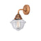 Oxford Sconce shown in the Antique Copper finish with a Clear shade