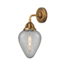 Geneseo Sconce shown in the Brushed Brass finish with a Clear Crackled shade