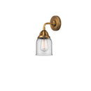 Bell Sconce shown in the Brushed Brass finish with a Clear shade