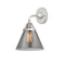 Cone Sconce shown in the Polished Chrome finish with a Plated Smoke shade