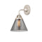 Cone Sconce shown in the Polished Nickel finish with a Plated Smoke shade