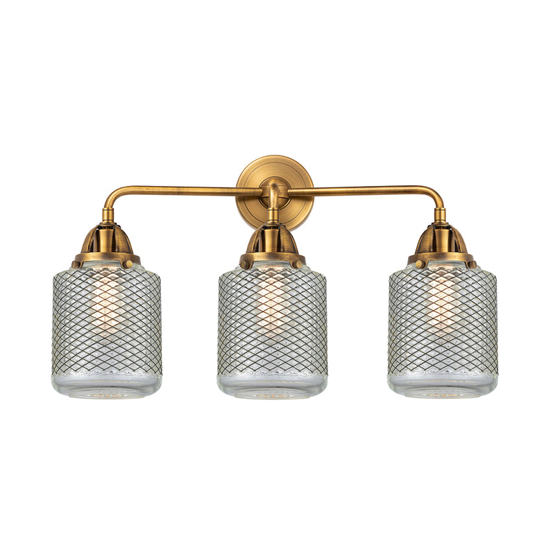 Stanton Bath Vanity Light shown in the Brushed Brass finish with a Clear Wire Mesh shade