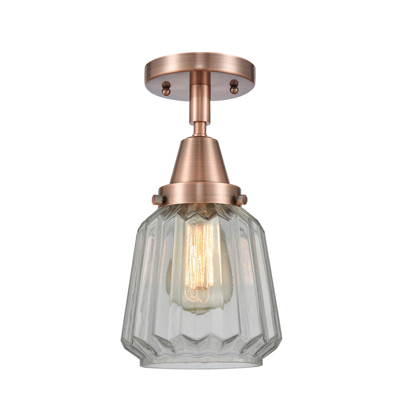 Chatham Flush Mount shown in the Antique Copper finish with a Clear shade