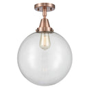 Beacon Flush Mount shown in the Antique Copper finish with a Clear shade