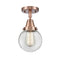 Beacon Flush Mount shown in the Antique Copper finish with a Clear shade