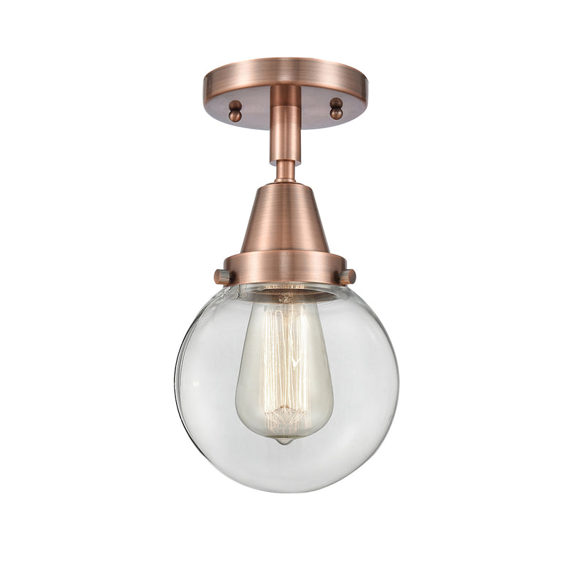 Beacon Flush Mount shown in the Antique Copper finish with a Clear shade