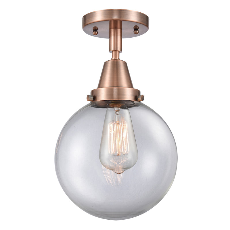 Beacon Flush Mount shown in the Antique Copper finish with a Clear shade