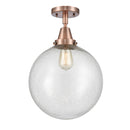 Beacon Flush Mount shown in the Antique Copper finish with a Seedy shade