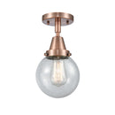 Beacon Flush Mount shown in the Antique Copper finish with a Seedy shade