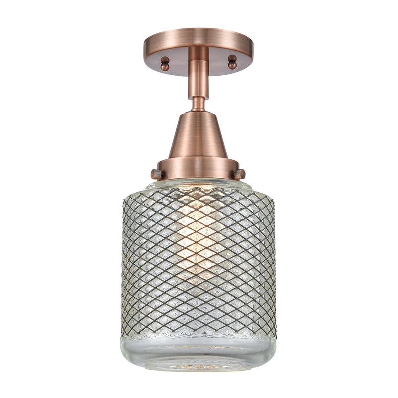 Stanton Flush Mount shown in the Antique Copper finish with a Clear Wire Mesh shade