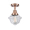 Oxford Flush Mount shown in the Antique Copper finish with a Clear shade