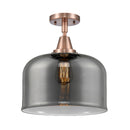 Bell Flush Mount shown in the Antique Copper finish with a Plated Smoke shade