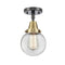 Beacon Flush Mount shown in the Black Antique Brass finish with a Clear shade