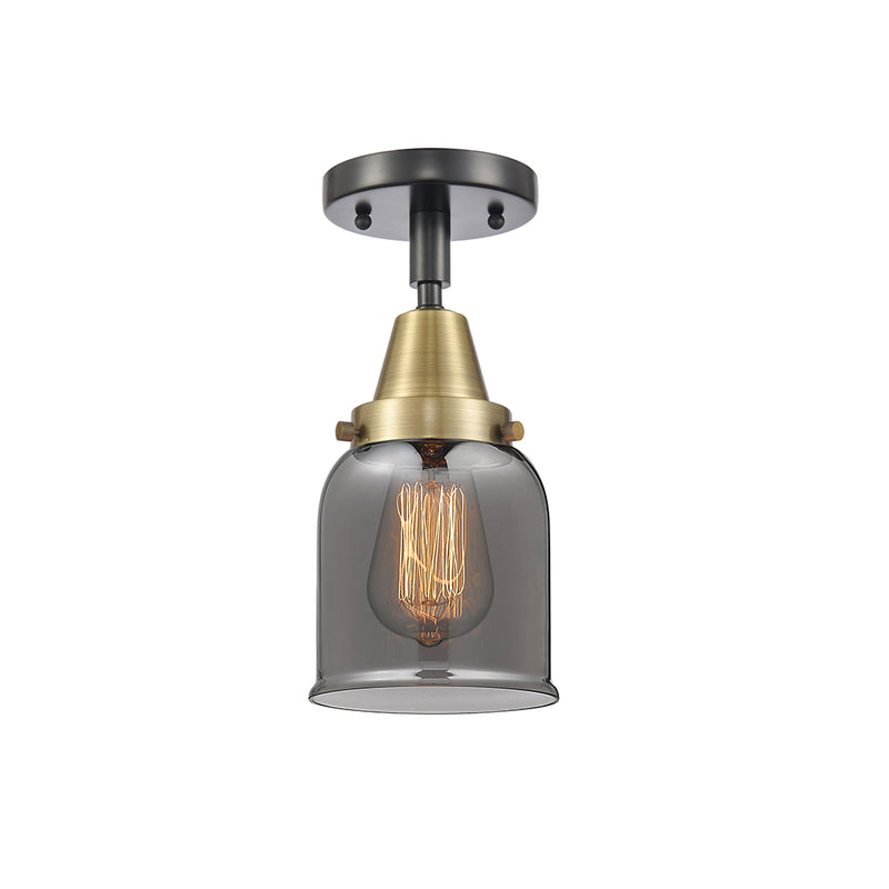 Bell Flush Mount shown in the Black Antique Brass finish with a Plated Smoke shade