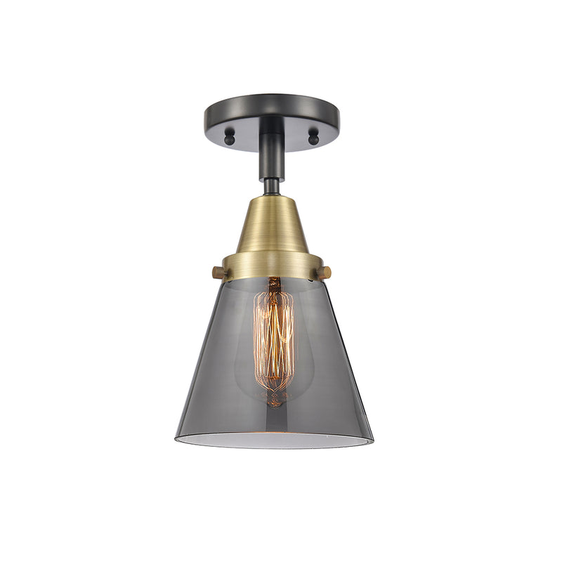 Cone Flush Mount shown in the Black Antique Brass finish with a Plated Smoke shade