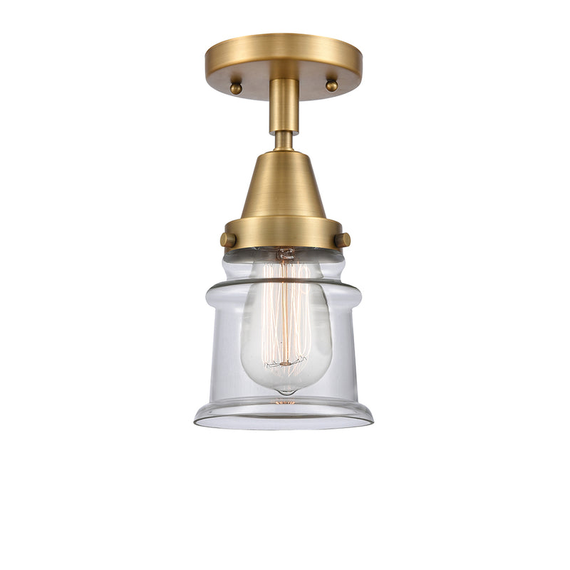 Canton Flush Mount shown in the Brushed Brass finish with a Clear shade