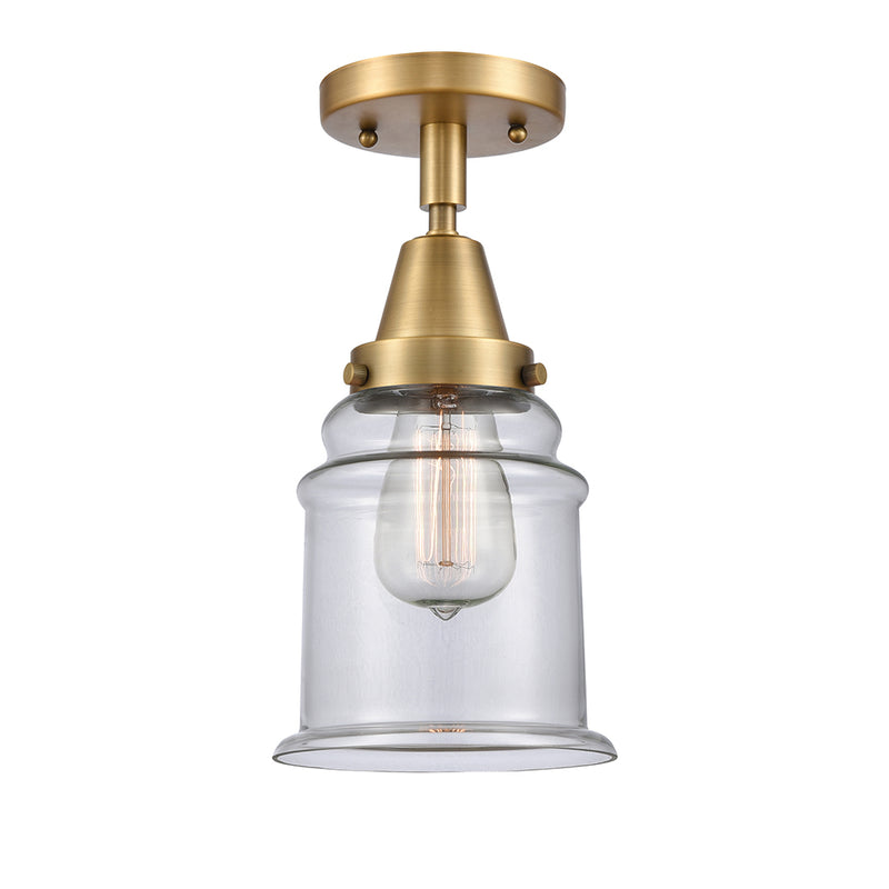 Canton Flush Mount shown in the Brushed Brass finish with a Clear shade