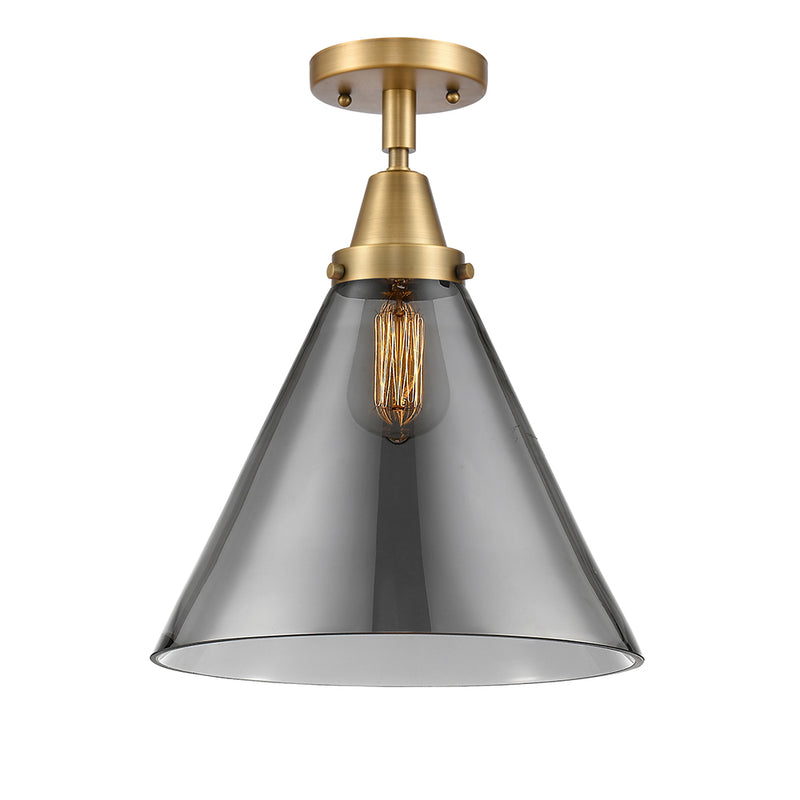Cone Flush Mount shown in the Brushed Brass finish with a Plated Smoke shade