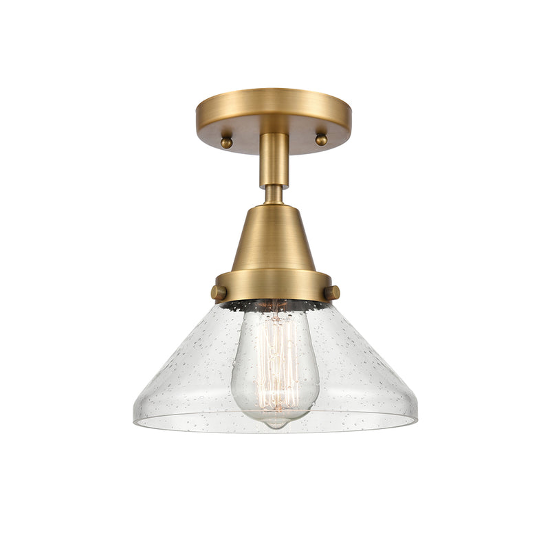 Caden Flush Mount shown in the Brushed Brass finish with a Seedy shade