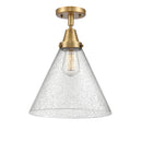 Cone Flush Mount shown in the Brushed Brass finish with a Seedy shade