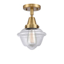 Oxford Flush Mount shown in the Brushed Brass finish with a Clear shade