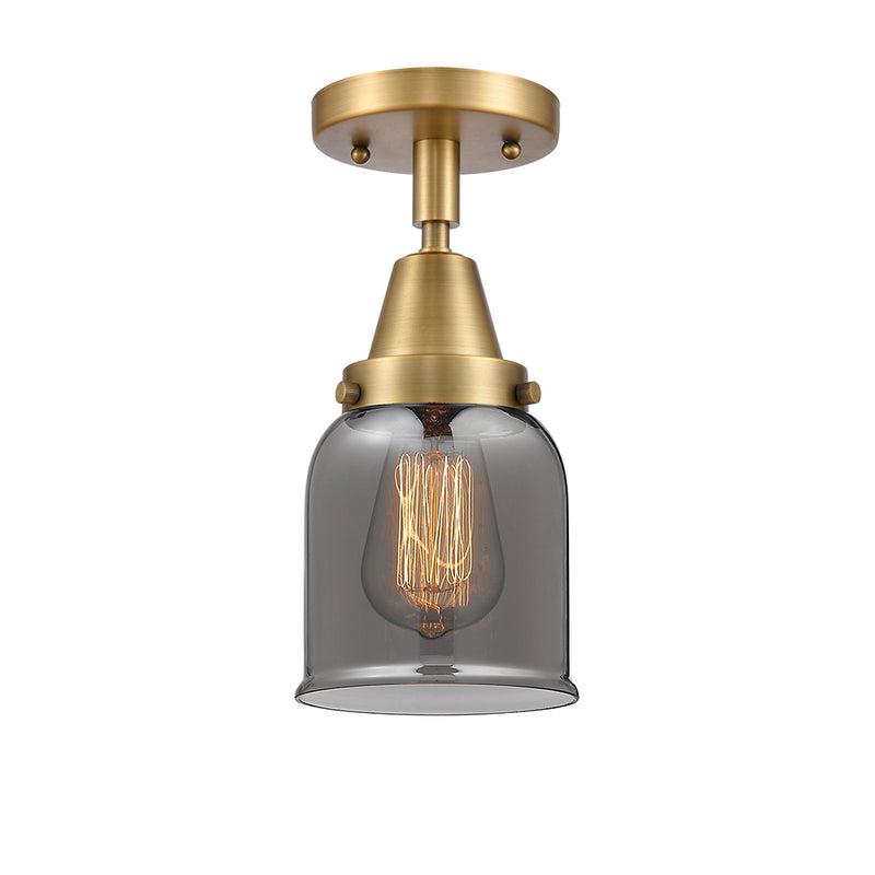 Bell Flush Mount shown in the Brushed Brass finish with a Plated Smoke shade