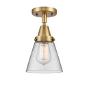 Cone Flush Mount shown in the Brushed Brass finish with a Clear shade