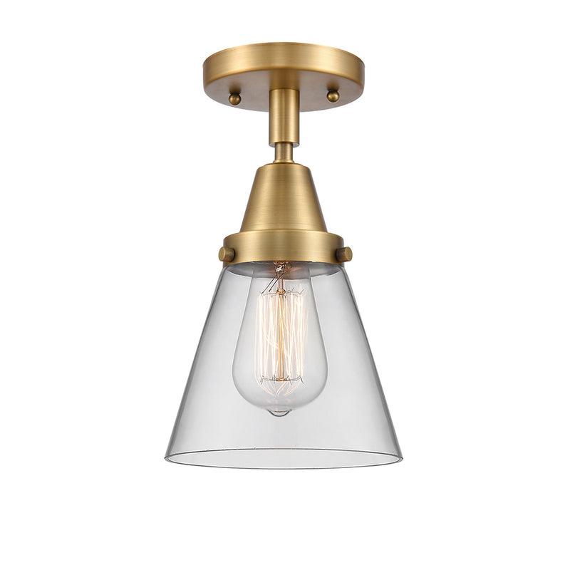 Cone Flush Mount shown in the Brushed Brass finish with a Clear shade