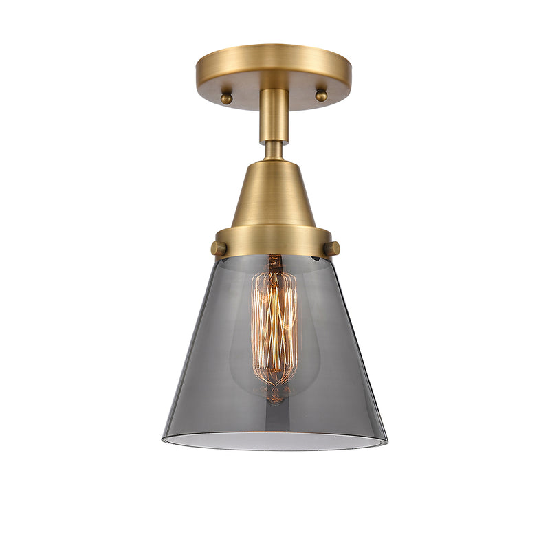 Cone Flush Mount shown in the Brushed Brass finish with a Plated Smoke shade