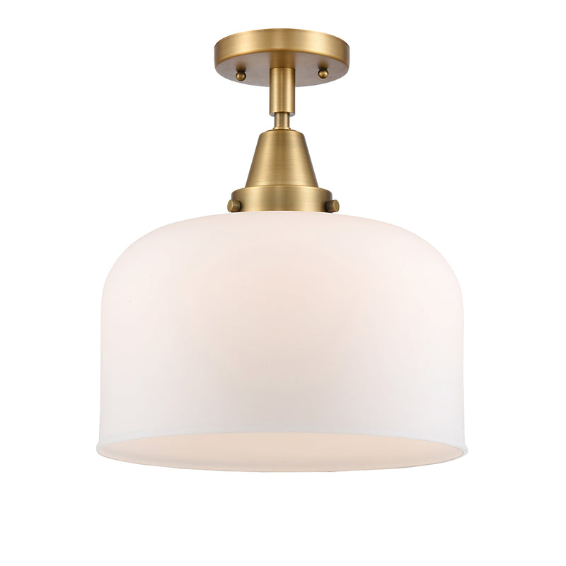 Bell Flush Mount shown in the Brushed Brass finish with a Matte White shade