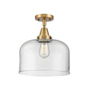 Bell Flush Mount shown in the Brushed Brass finish with a Clear shade
