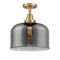 Bell Flush Mount shown in the Brushed Brass finish with a Plated Smoke shade