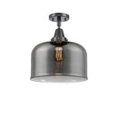 Bell Flush Mount shown in the Matte Black finish with a Plated Smoke shade