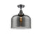 Bell Flush Mount shown in the Matte Black finish with a Plated Smoke shade