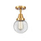 Beacon Flush Mount shown in the Satin Gold finish with a Clear shade