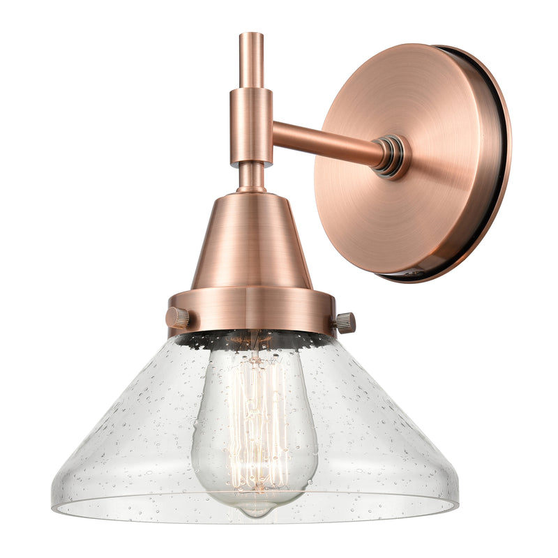 Caden Sconce shown in the Antique Copper finish with a Seedy shade