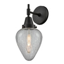 Caden Sconce shown in the Matte Black finish with a Clear Crackled shade