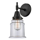 Caden Sconce shown in the Matte Black finish with a Clear shade