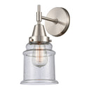 Caden Sconce shown in the Satin Nickel finish with a Seedy shade