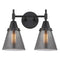 Caden Bath Vanity Light shown in the Matte Black finish with a Plated Smoke shade