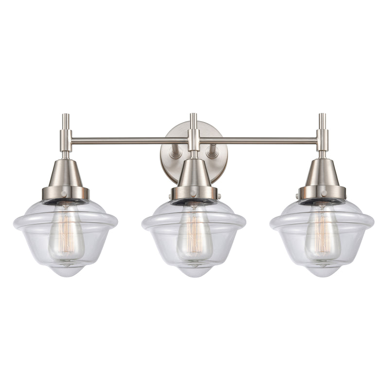 Caden Bath Vanity Light shown in the Satin Nickel finish with a Clear shade