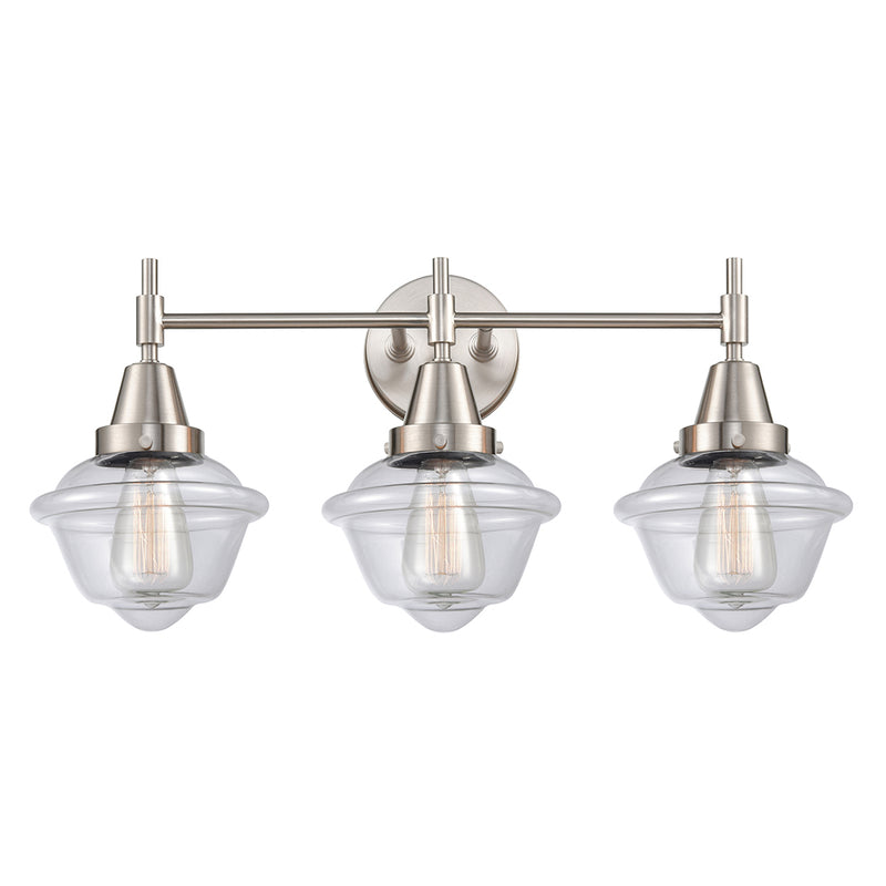 Caden Bath Vanity Light shown in the Satin Nickel finish with a Clear shade