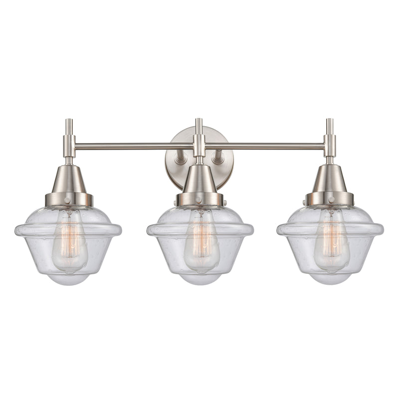 Caden Bath Vanity Light shown in the Satin Nickel finish with a Seedy shade