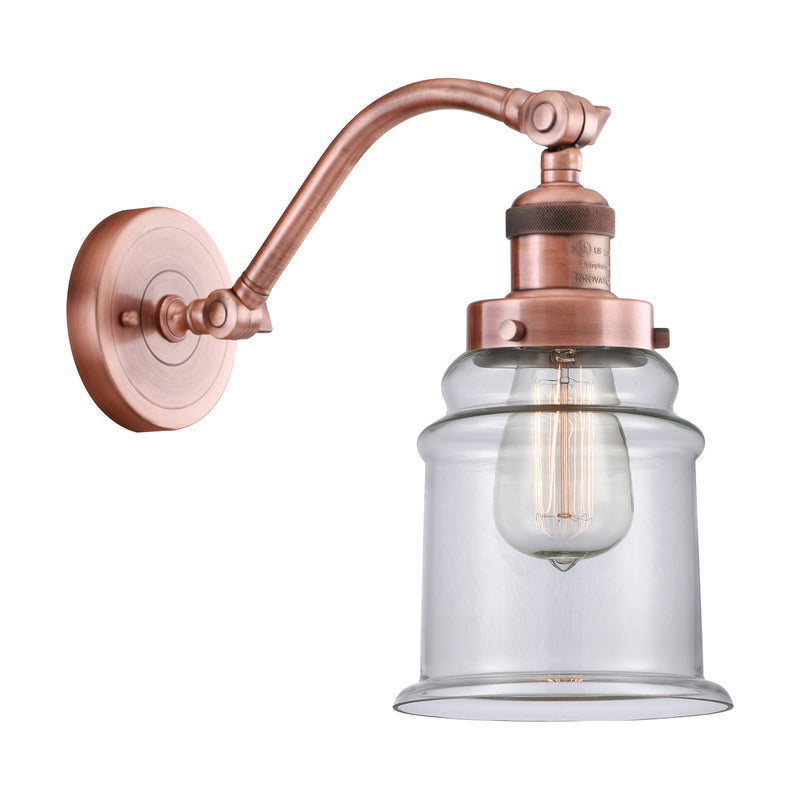 Canton Sconce shown in the Antique Copper finish with a Clear shade