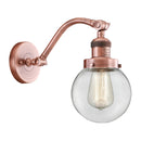 Beacon Sconce shown in the Antique Copper finish with a Clear shade