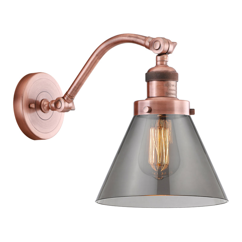 Cone Sconce shown in the Antique Copper finish with a Plated Smoke shade